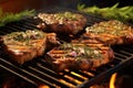 bbq pork chops with herbs and spices on grill grate Royalty Free Stock Photo