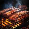 bbq pork ribs cooking on flaming grill. grilling baby back pork ribs over flaming grill Royalty Free Stock Photo