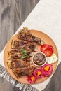 BBQ pork ribs with fermented, baked and fresh vegetables