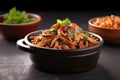 bbq pulled pork bowl on slate background, garnished with parsley Royalty Free Stock Photo