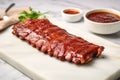 bbq ribs brushed with sauce on a marble slab Royalty Free Stock Photo