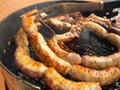 BBQ with ribs pork, sausage, meatballs, grill in the garden of a house. Chef cooking barbecue with delicious grilled meat Royalty Free Stock Photo