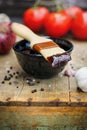 BBQ Sauce in a Bowl with Brush over a Rustic Background Royalty Free Stock Photo