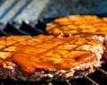 BBQ sauce on the the grilling burgers. Calgary Alberta Canada Royalty Free Stock Photo