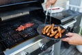 BBQ with sausages and red meat on the grill Royalty Free Stock Photo