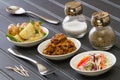 BBQ Side Dishes on Black Table with Fork, Spoon, Salt, Pepper and Toothpicks