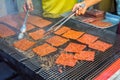 Bbq slice meat pork in the street food Jalan Alor in Kuala Lumpur