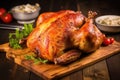 bbq smoked whole chicken resting on a wooden board