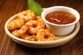 bbq spiced shrimp with dipping sauce in a small bowl