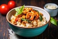 bbq spiced shrimps served with brown rice in a bowl