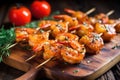 bbq spiced shrimps on a wooden skewer, just grilled