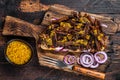 BBQ Texas Sandwich with slow roasted brisket beef meat. Dark wooden background. Top view