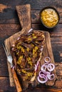 BBQ Texas Sandwich with slow roasted brisket beef meat. Dark wooden background. Top view