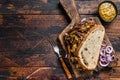 BBQ Texas Sandwich with slow roasted brisket beef meat. Dark wooden background. Top view. Copy space