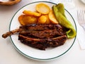 BBQ veal ribs with fried potatoes and baked pepper Royalty Free Stock Photo