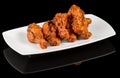 BBQ WINGS  on black background with reflection Royalty Free Stock Photo