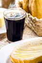 Bbread with butter and black coffee. Brazilian typical French bread with strong coffee cup, Brazilian breakfast Royalty Free Stock Photo