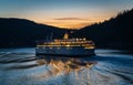 BC Ferries company passenger vessel Spirit of British Columbia on the sea at sunset time