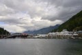 The BC Ferry Horseshoe Bay terminal with two docked ferries and beautiful mountain background. Royalty Free Stock Photo