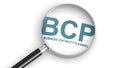 BCP, business continuity planning,  word under magnifying glass Royalty Free Stock Photo