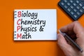 BCPM biology chemistry physics math symbol. Concept words BCPM biology chemistry physics math on the note on beautiful orange Royalty Free Stock Photo