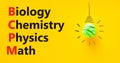 BCPM biology chemistry physics math symbol. Concept words BCPM biology chemistry physics math on yellow paper on beautiful yellow Royalty Free Stock Photo