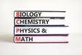 BCPM biology chemistry physics math symbol. Concept words BCPM biology chemistry physics math on books on beautiful white Royalty Free Stock Photo