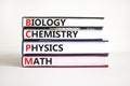 BCPM biology chemistry physics math symbol. Concept words BCPM biology chemistry physics math on books on beautiful white Royalty Free Stock Photo