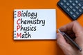 BCPM biology chemistry physics math symbol. Concept words BCPM biology chemistry physics math on the note on beautiful orange Royalty Free Stock Photo