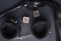 BDSM lash and leather handcuffs and sex cubes. Sex toys, night games Royalty Free Stock Photo