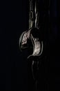 BDSM Leather handcuffs for role-playing games on a black background. Bondage for carnal pleasures. Domination and Royalty Free Stock Photo