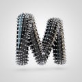 BDSM black latex letter M uppercase with chrome spikes isolated on white background
