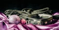 bdsm still life leather collar shibari rope and christmas ball on pink cloth