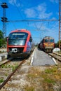 BDZ (Bulgarian State Railways) Freight and passenger trains at the station in Asenovgrad, Bulgaria.