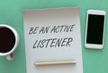 Be An Active Listener, message on paper, smart phone and coffee