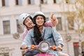 Attractive positive couple trying motorbike tour