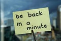 Be back in a minute written Royalty Free Stock Photo