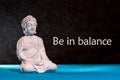 Be in Balance - motivation for balancing between life, work, family, sport and yoga. Meditating Buddha Royalty Free Stock Photo