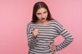 Be careful, I`m warning! Portrait of strict bossy brunette woman in striped sweatshirt giving advice, scolding