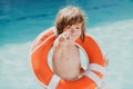 Be careful on water. Kids saving life. Helping concept. Child with rescue circle. Summer beach. Royalty Free Stock Photo