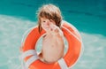 Be careful on water. Kids saving life. Helping concept. Child with rescue circle. Summer beach. Royalty Free Stock Photo