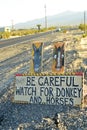 Be Careful of wild donkey and horses road sign along side highway Pahrump, Nevada, USA Royalty Free Stock Photo