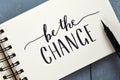 BE THE CHANGE hand-lettered in notepad with brush pen
