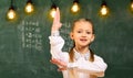 Students usually get excited about the material. Attentive schoolkid is doing his math homework in classroom at school