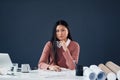 Be fully focused on your vision. Portrait of an attractive young female architect looking thoughtful while working in Royalty Free Stock Photo