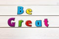 Be Great. Positive affirmation, statement. Bold neon letters on white washed background