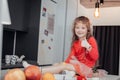 Positive delighted child sitting on the table Royalty Free Stock Photo