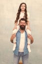 Be happy and smile. Happy family have fun together. Father piggyback little daughter. Bearded man and small child Royalty Free Stock Photo