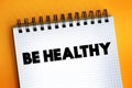 Be Healthy text on notepad, concept background