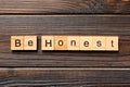 Be honest word written on wood block. be honest text on table, concept Royalty Free Stock Photo